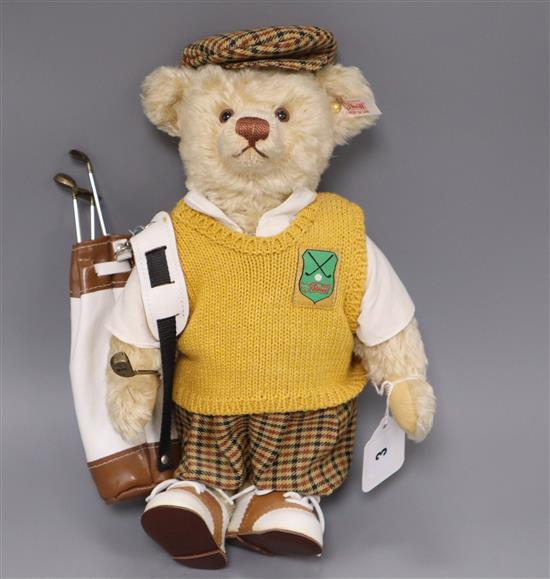 A Steiff golfer bear, boxed with bag 32cm